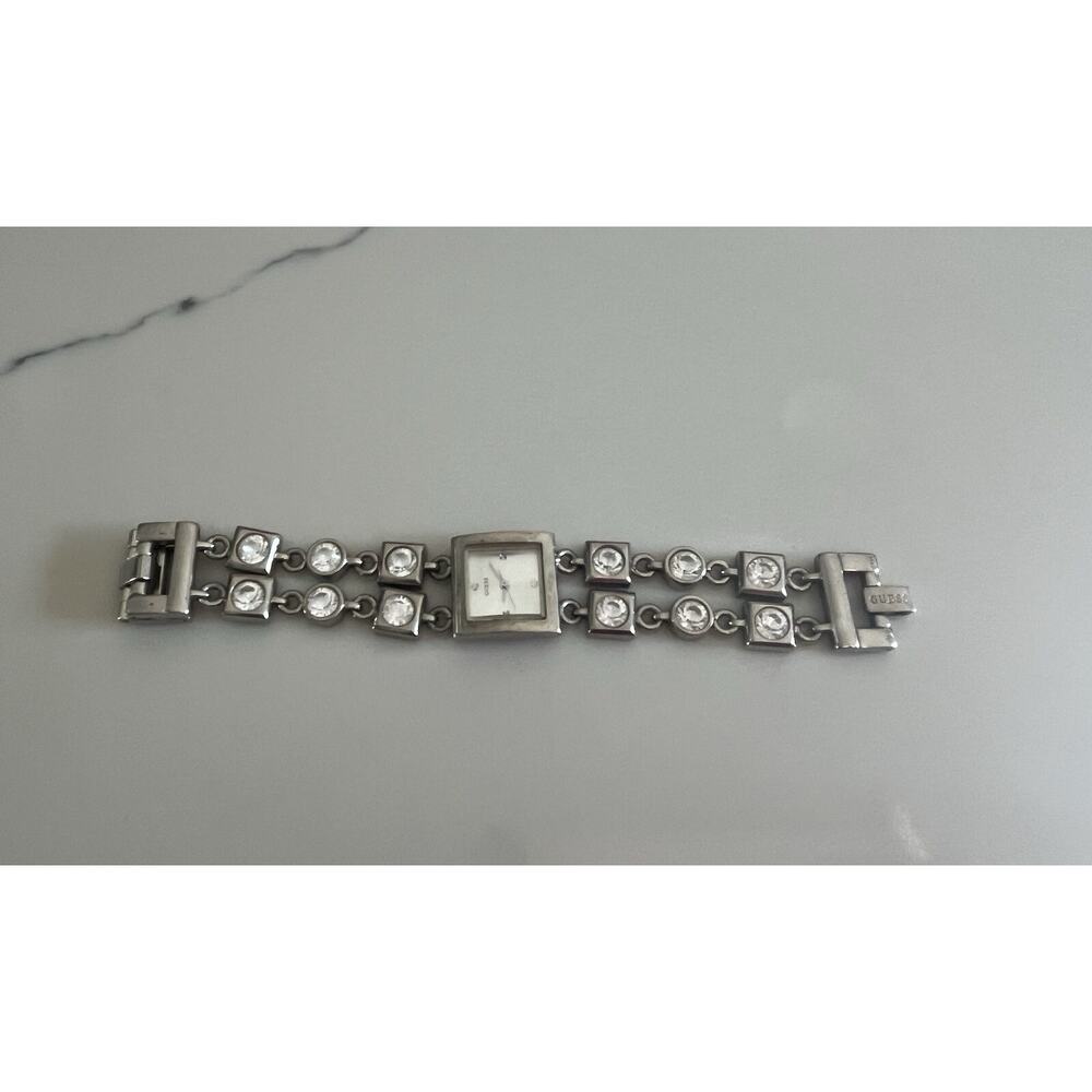 Guess women’s silver- tone bracelet watch water resistant